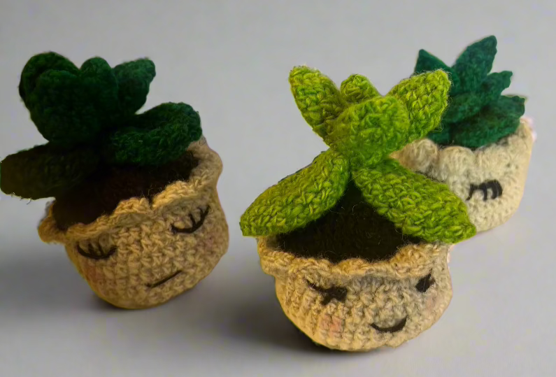 handcrafted wool succulents in a little pot. measures about 3.5" high by 3"