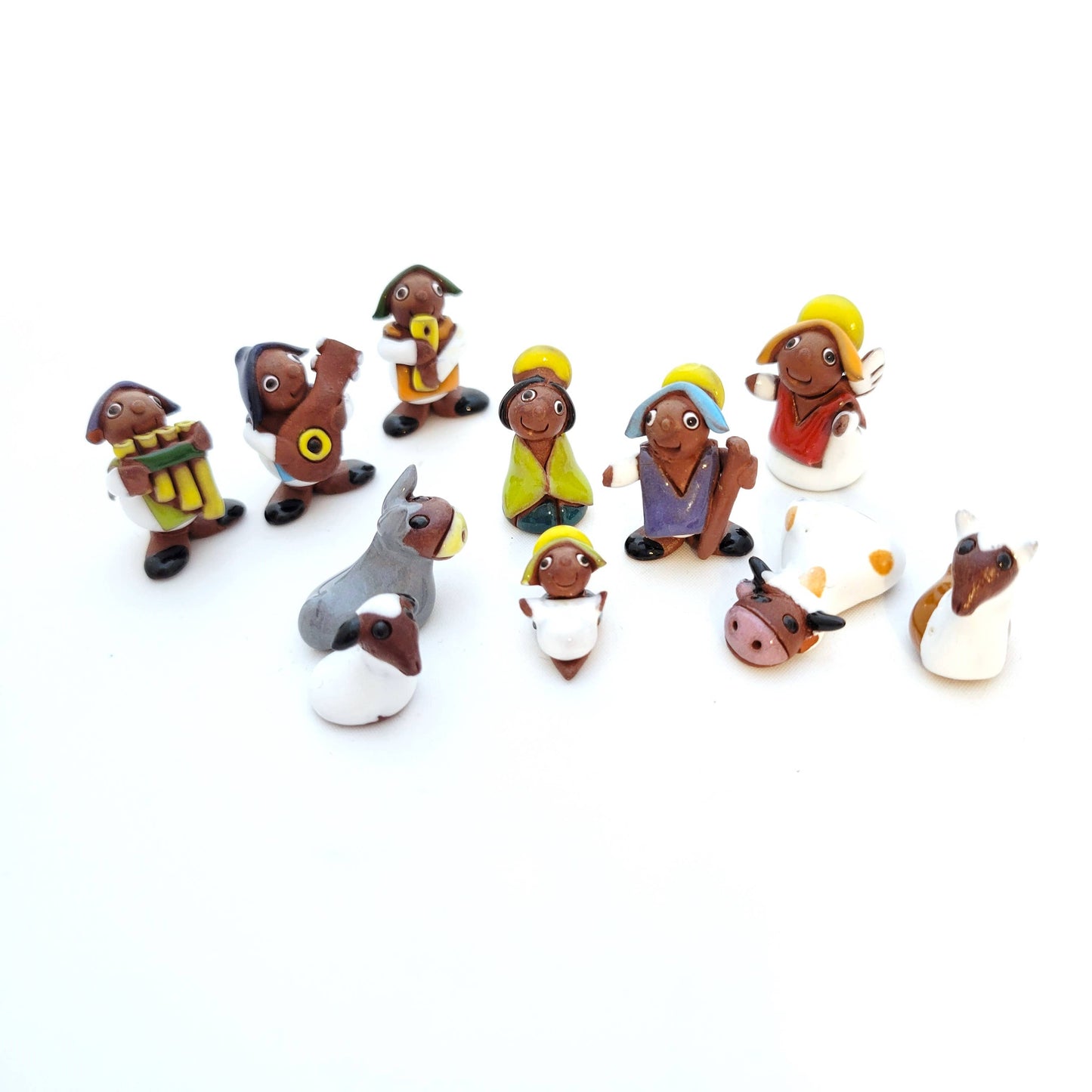 Eleven Piece Miniature Painted Nativity Set