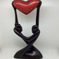 Uplifting Our Love wooden sculpture